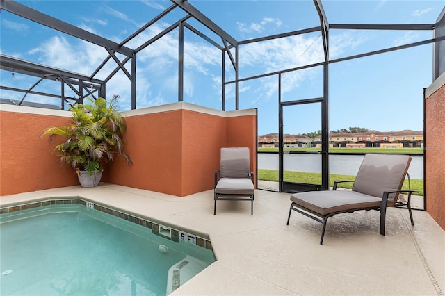 view of swimming pool featuring a water view, a patio area, and a lanai