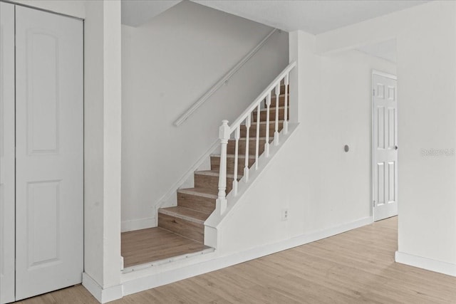 stairway featuring hardwood / wood-style floors