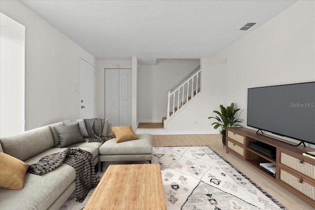 living room with light hardwood / wood-style flooring