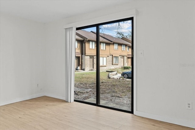 doorway to outside with light hardwood / wood-style flooring