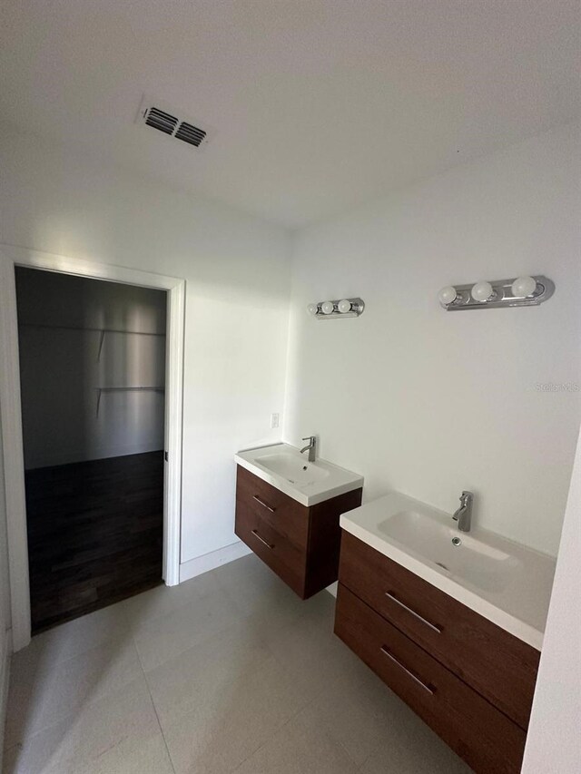 bathroom with dual vanity