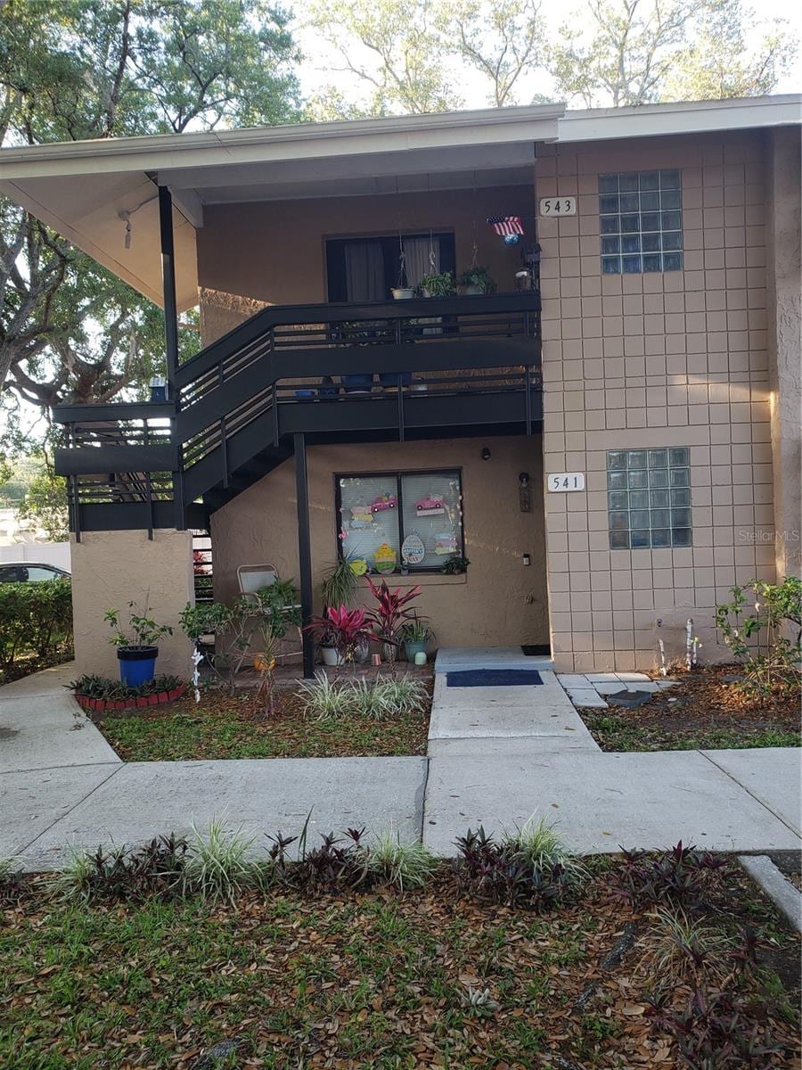 view of front of house featuring a balcony