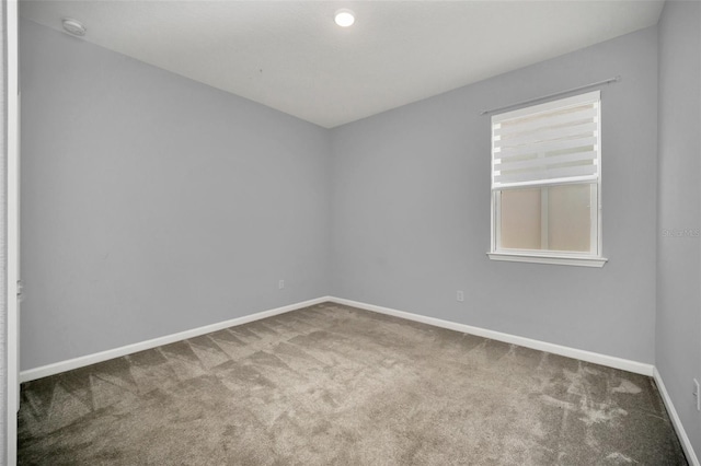 unfurnished room with carpet