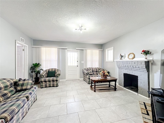 living room featuring light tile floors, a textured ceiling, and a fireplace