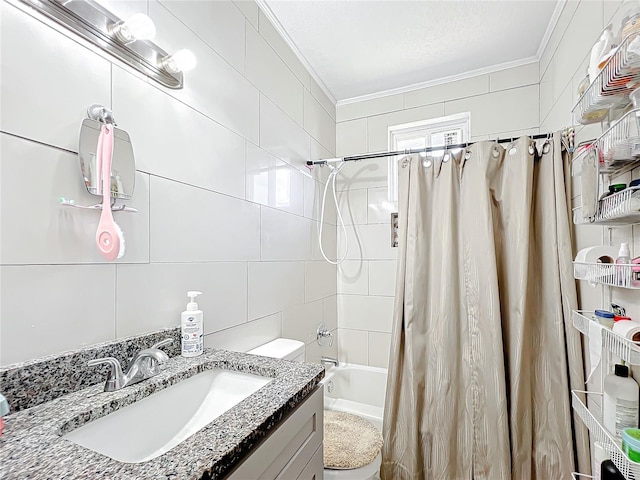 full bathroom featuring vanity, tile walls, toilet, shower / tub combo, and ornamental molding