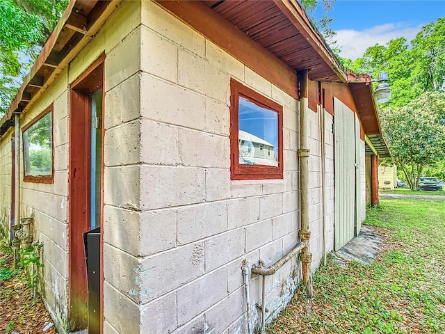 view of side of property with a yard