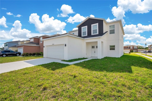 view of front of property with a front yard and a garage