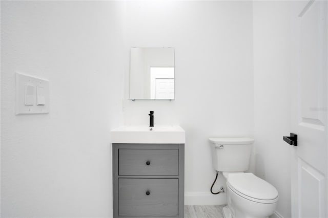 bathroom with oversized vanity and toilet