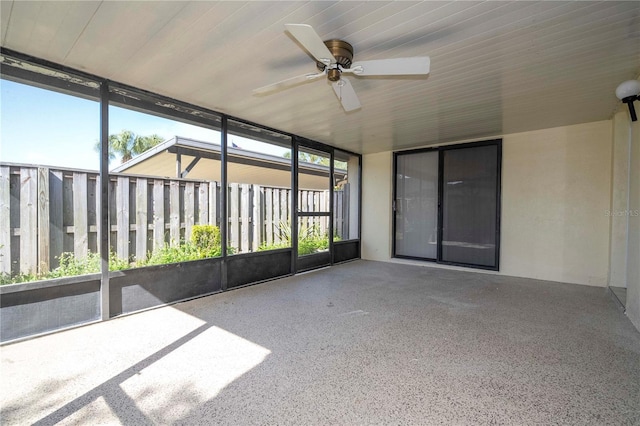 unfurnished sunroom featuring plenty of natural light and ceiling fan