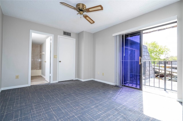 empty room featuring a textured ceiling and ceiling fan