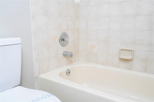 bathroom featuring toilet and a bathing tub