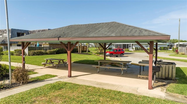 view of home's community with a yard