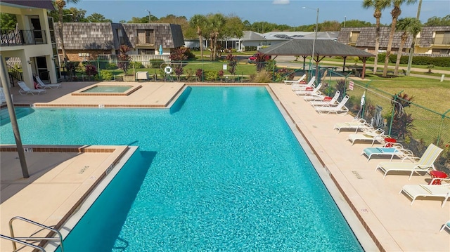 view of swimming pool with a hot tub, a patio area, and a gazebo