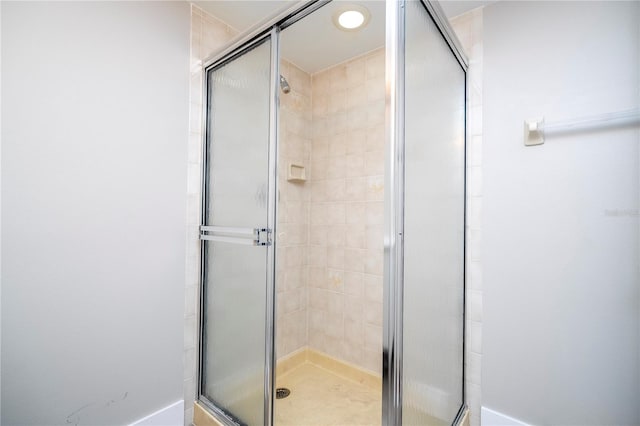 bathroom featuring an enclosed shower