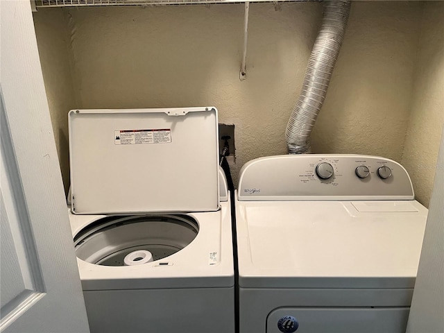 washroom featuring washer hookup and washing machine and clothes dryer