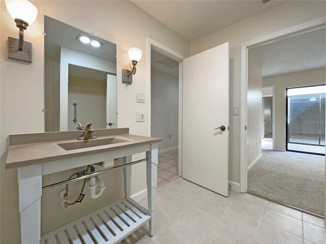 bathroom featuring sink and tile patterned floors