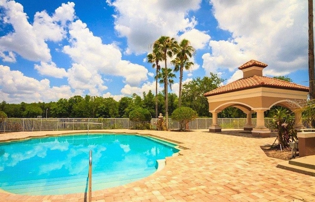 view of swimming pool with fence and a fenced in pool