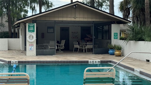 view of swimming pool with a patio area