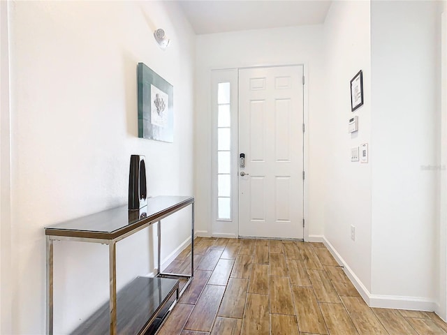 entryway with light hardwood / wood-style floors