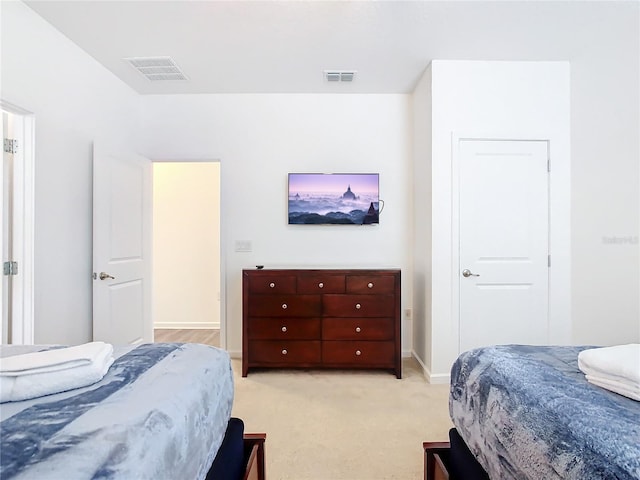 bedroom with light carpet