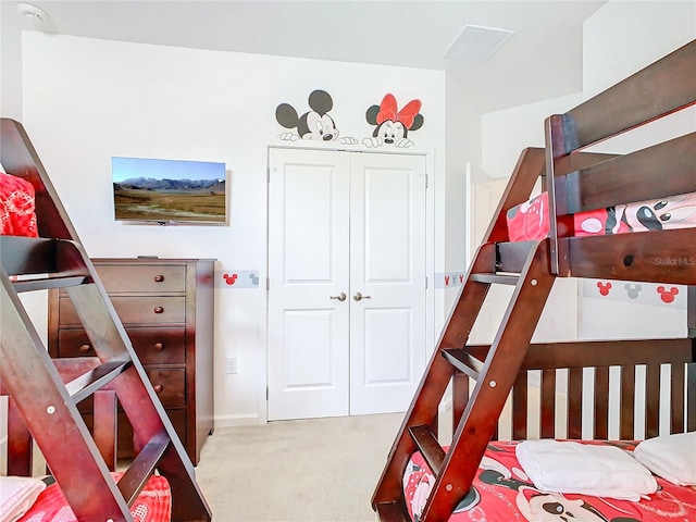 carpeted bedroom featuring a closet