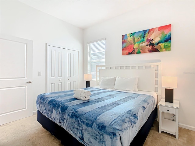 carpeted bedroom with a closet