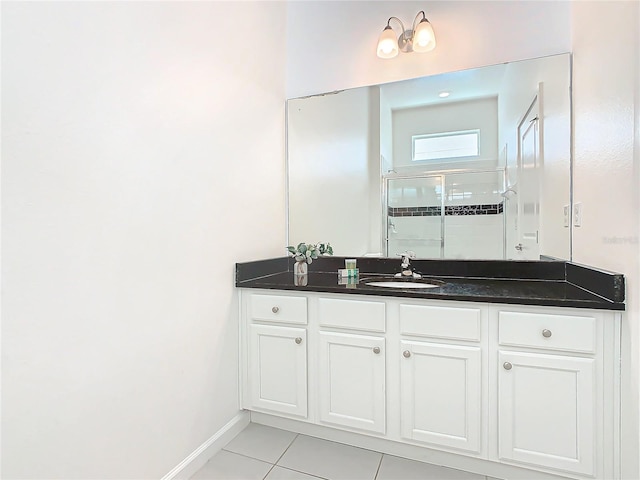 bathroom featuring tile floors and vanity