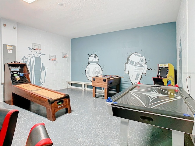 playroom featuring a textured ceiling