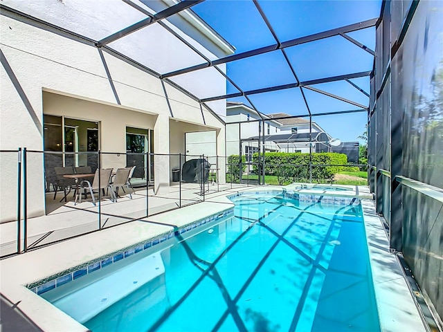 view of pool featuring a lanai and a patio area