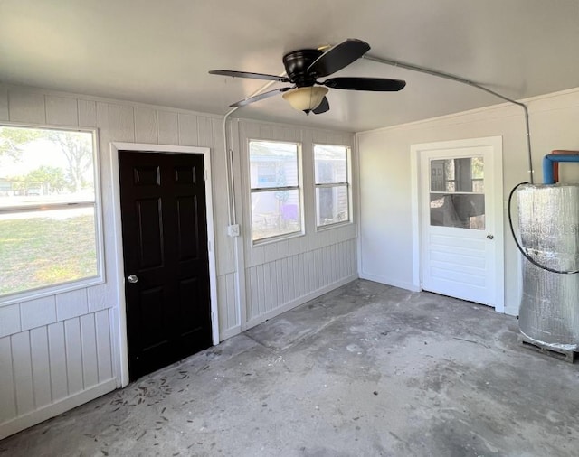 foyer entrance with water heater and ceiling fan