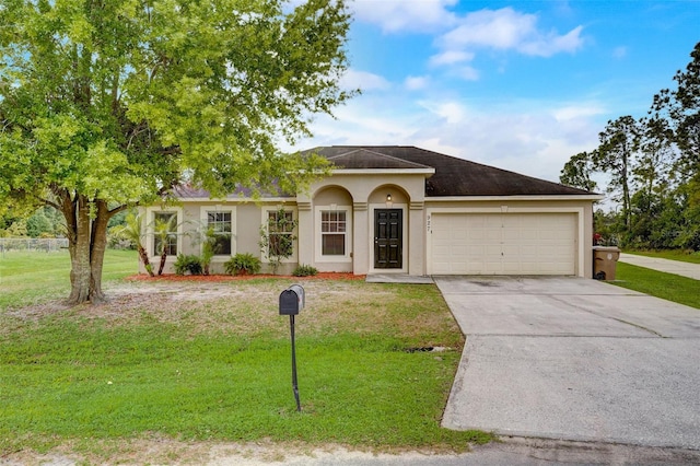 single story home featuring a front lawn and a garage