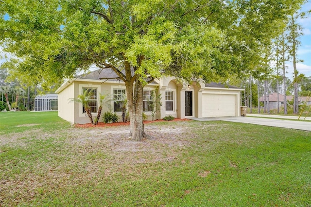 view of property hidden behind natural elements with a garage and a front yard