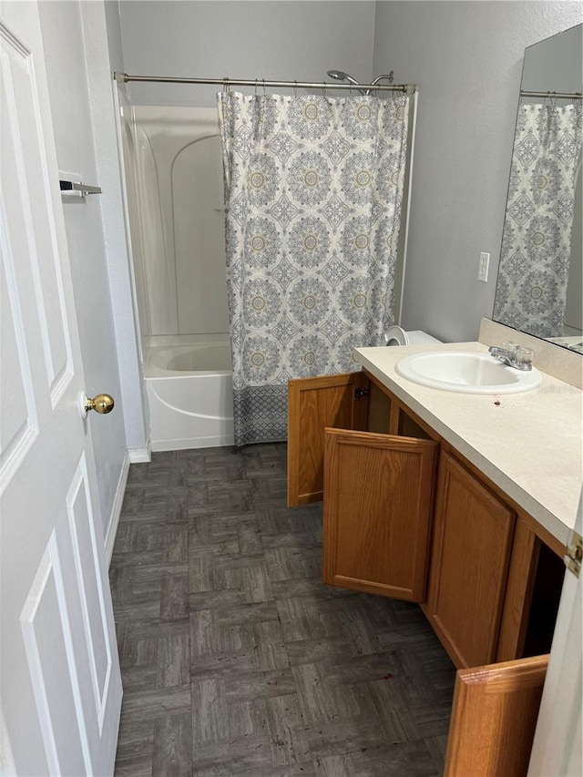 bathroom with shower / tub combo, vanity, and parquet floors