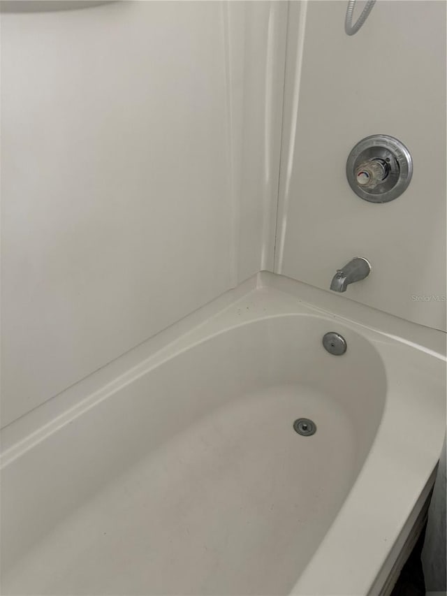 bathroom featuring a tub to relax in