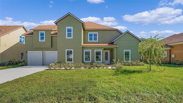 view of front of house with a garage and a front yard