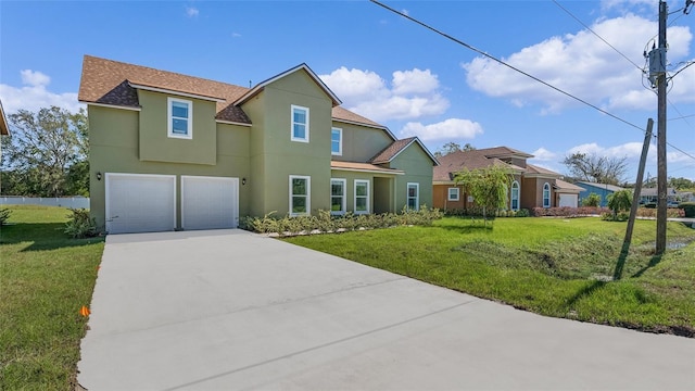 view of front of house featuring a front yard and a garage