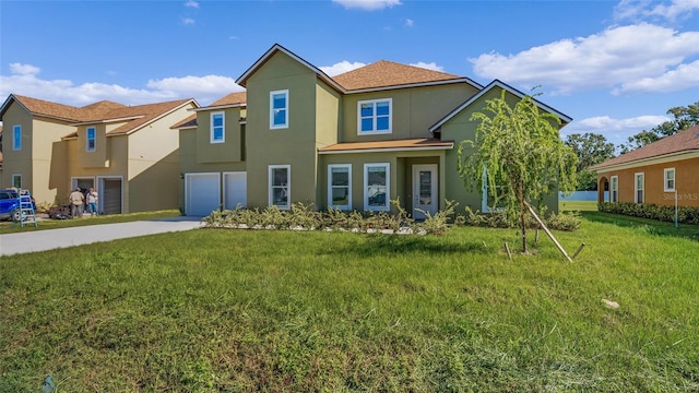 view of front of home featuring a garage and a front lawn