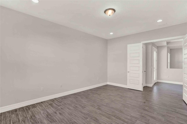 unfurnished room featuring dark hardwood / wood-style floors