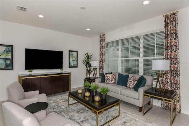 tiled living room with a textured ceiling