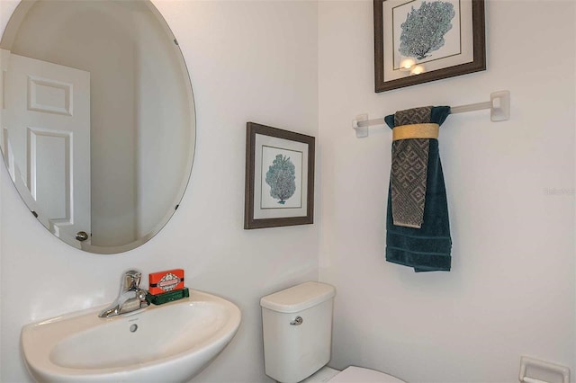 bathroom with toilet and sink