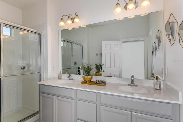 bathroom featuring vanity and a shower with shower door