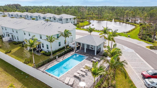 birds eye view of property with a water view