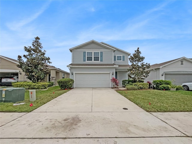 view of property with a front yard and a garage