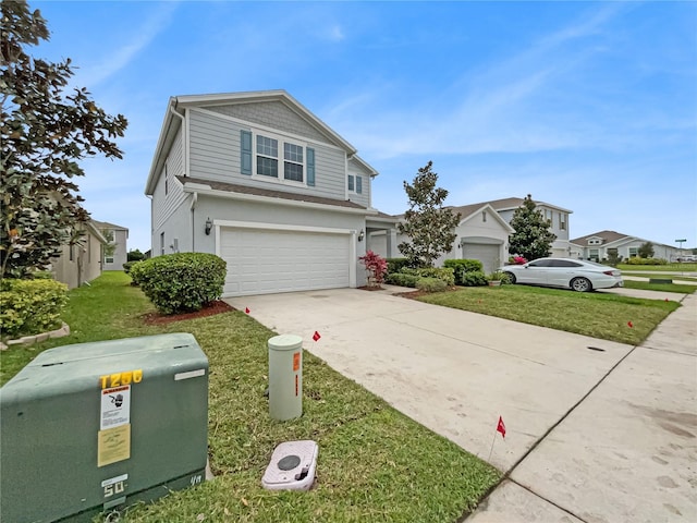 view of front property featuring a front yard and a garage