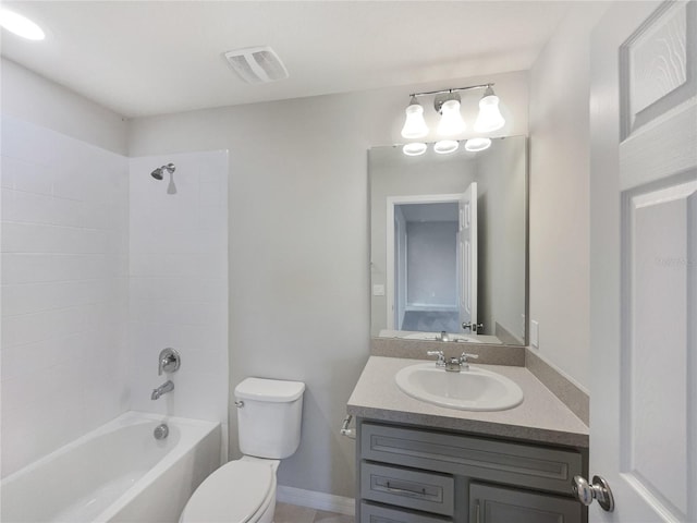 full bathroom featuring tiled shower / bath, toilet, and vanity