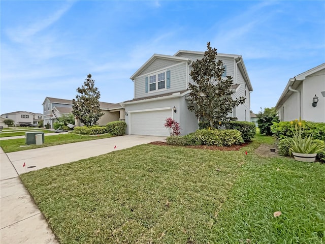 view of front of house featuring a front lawn and a garage