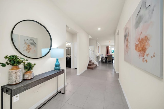 hallway with light tile patterned flooring