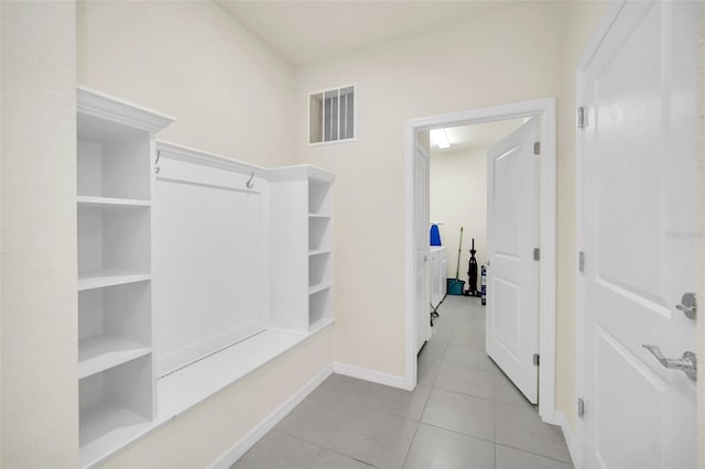 spacious closet featuring light tile patterned floors