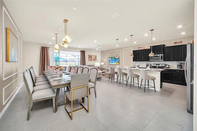 dining room with ceiling fan