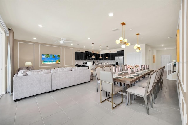 dining area featuring light tile patterned flooring and ceiling fan